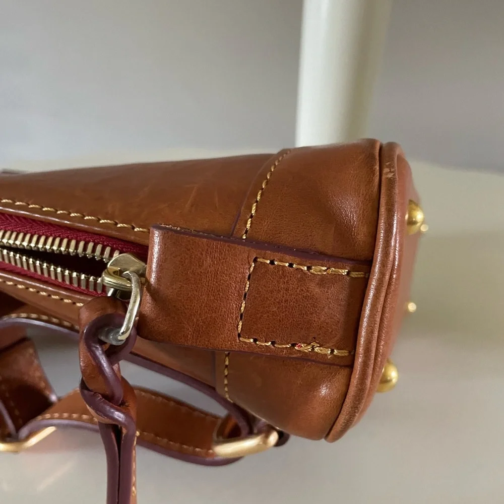 Dooney and Bourke Florentine leather small backpack.